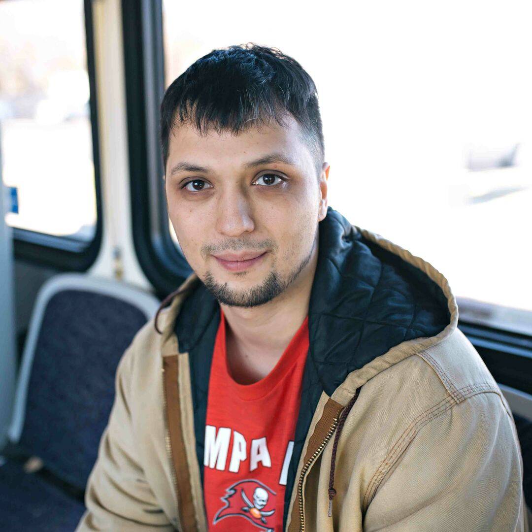 Image of DART rider Erik on a DART bus.
