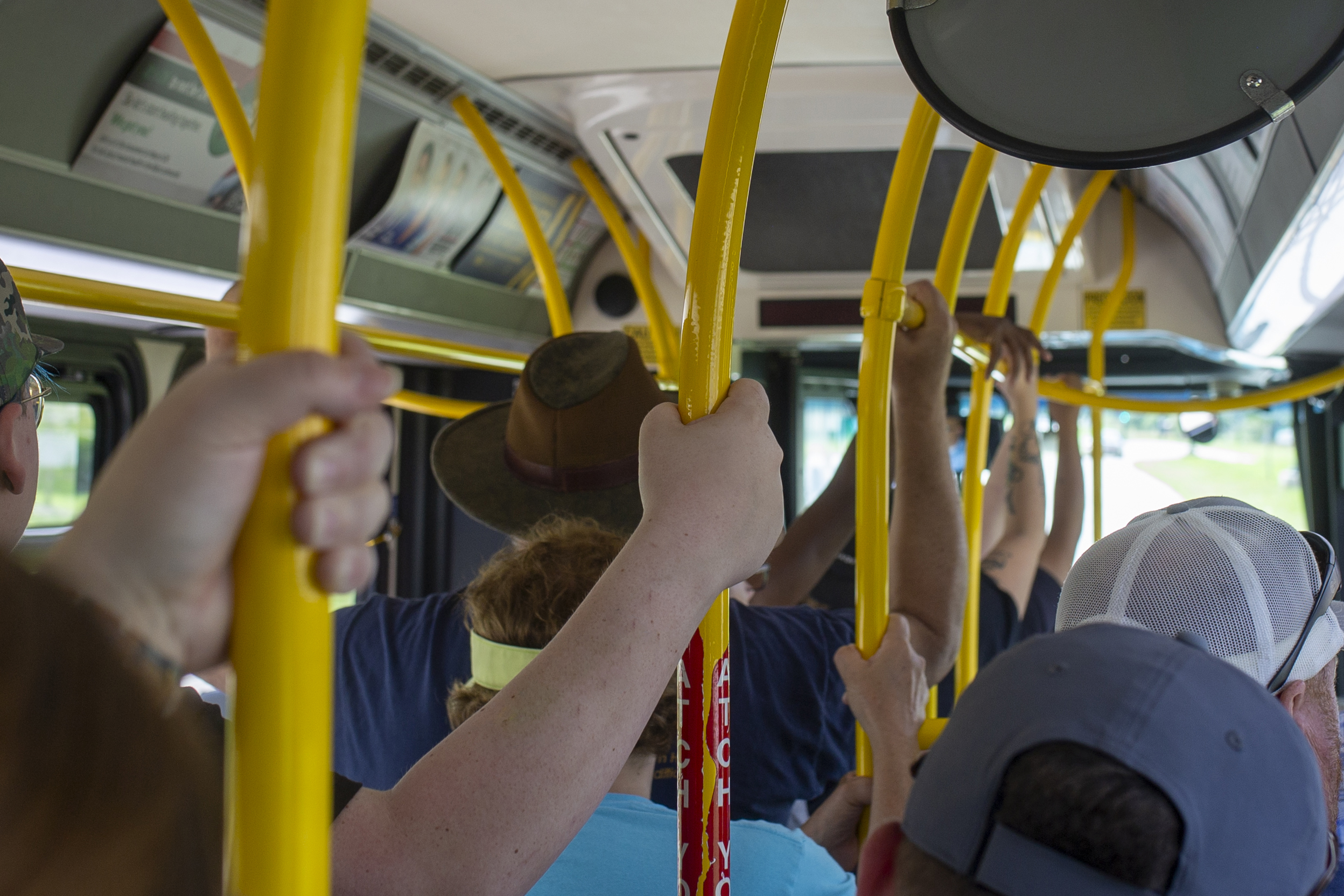 Riders on a DART bus