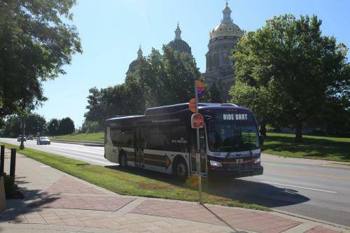 Iowa state capital building with bus